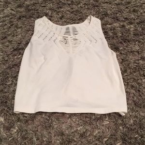 white cropped tank with cutouts.